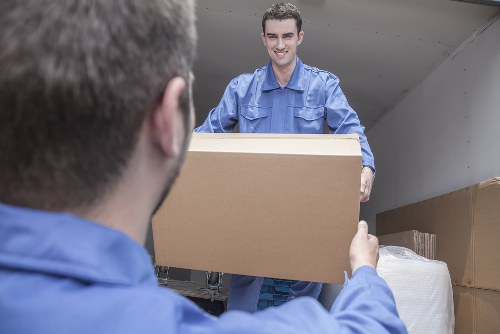 Man and van loading furniture in a Twickenham residential street