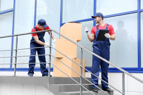 Workers using lifting equipment during a move