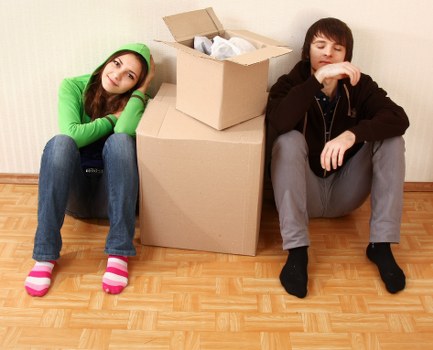 Professional movers handling furniture in a Twickenham home