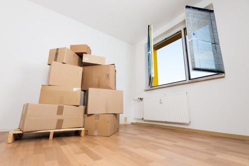 Removal team navigating a Twickenham street with furniture